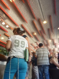 A woman at Aroma in Mamilla (Seth Frantzman)