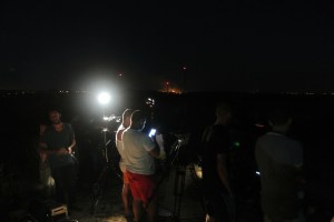 Some youth in the shadow of a journalist's camera