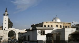 A church and mosque next to eachother in Syria