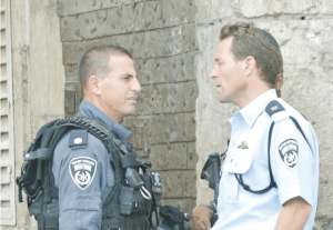 Micky Rosenfeld meets with a Yasam commander named Yaron Levy at Lion's Gate. (Seth J. Frantzman)