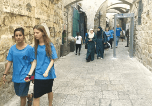 Jewish and Arab women walk in the Old CIty. (Seth J. Frantzman)